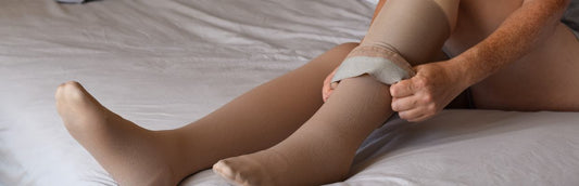 Person putting on compression stockings